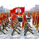 This April 25, 2007, picture, released from Korean Central News Agency, shows North Korean soldiers, carrying a large portrait of late North Korean leader Kim Il Sung, marching during a grand military parade to celebrate the 75th founding anniversary of the Korean People’s Army at the Kim Il Sung square in Pyongyang, North Korea. (KCNA/AFP/Getty Images)
